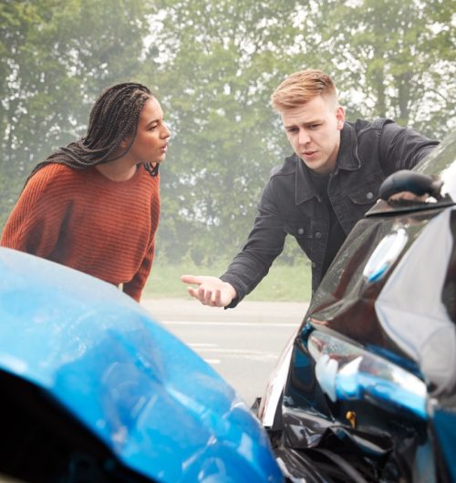 Two Angry Motorists Arguing Over Responsibility For Car Accident